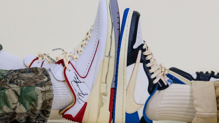 Girls wearing sneakers sitting in a structure outside